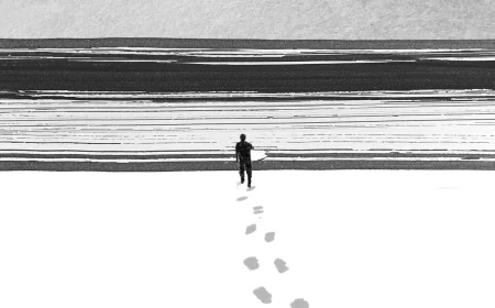 A Winter Surfer at Rockaway Beach Questions His Dedication